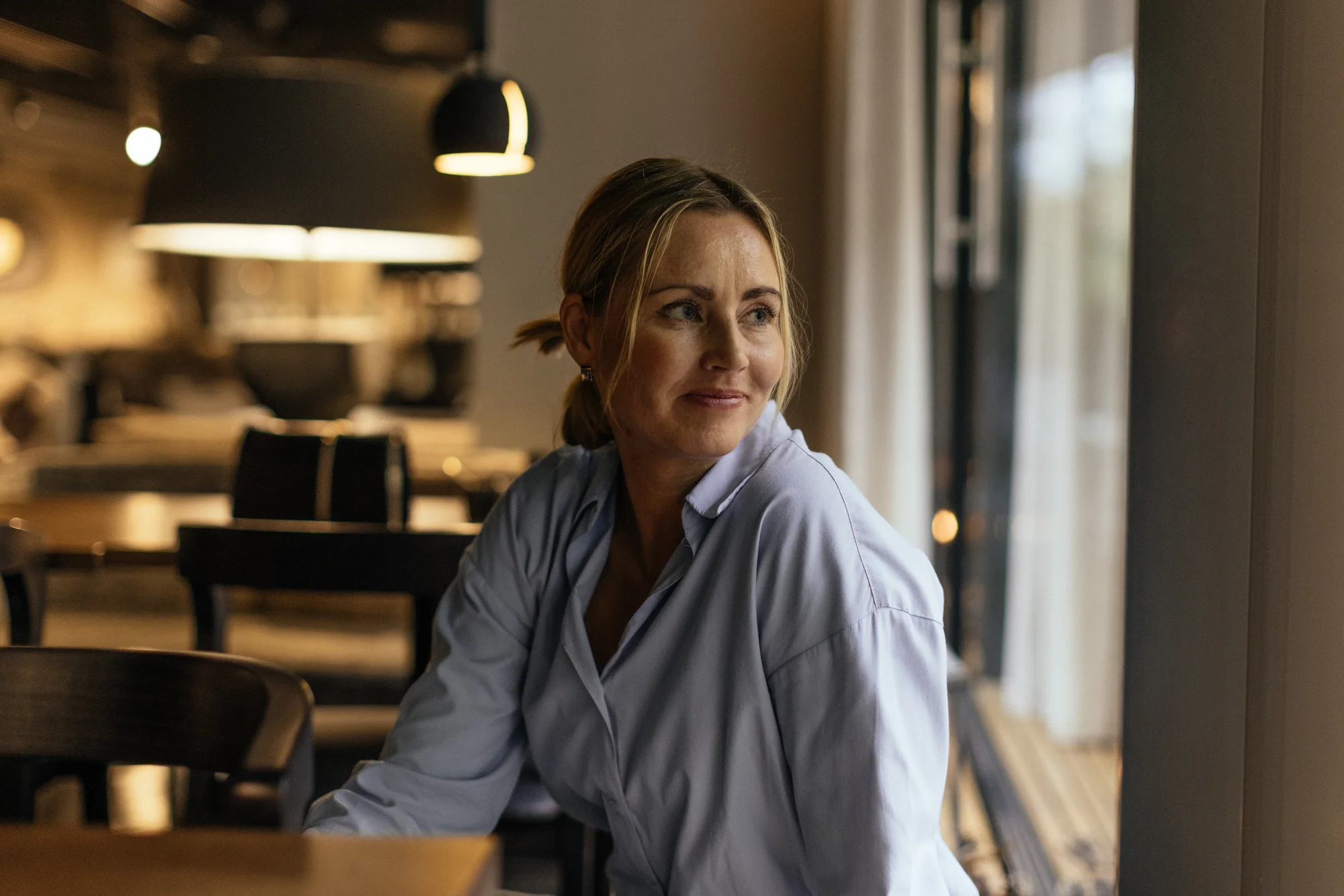 Woman seated in a café