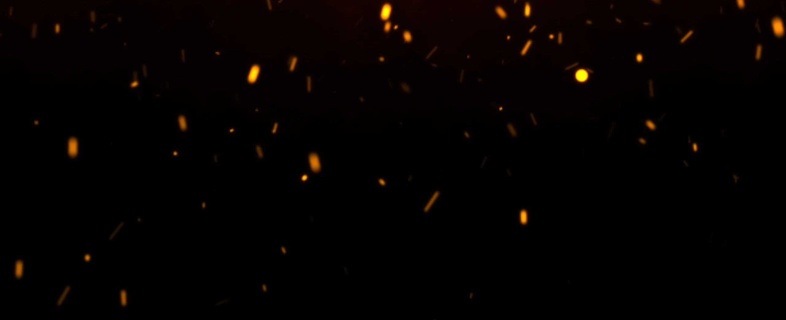 Glowing sparks against a dark background